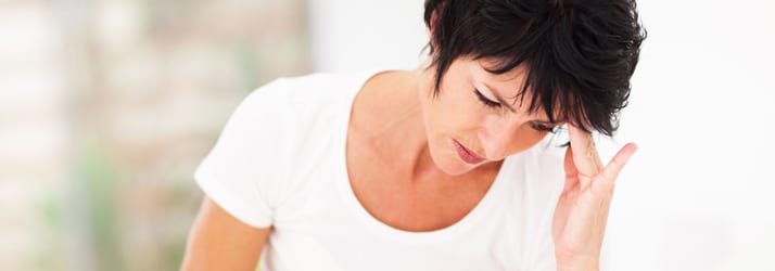 page - whiplash woman having headache